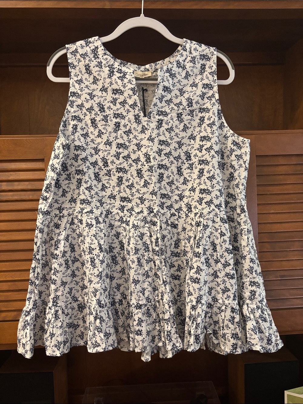 Sleeveless White Tunic with Navy Floral Print - Flowy Peplum Hem